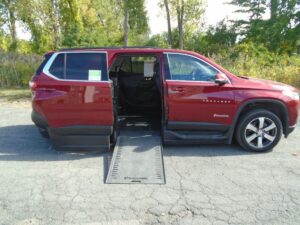 Red Chevrolet Traverse with BraunAbility Side Entry Automatic In Floor conversion