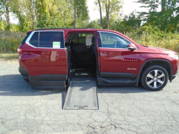 Red Chevrolet Traverse with BraunAbility Side Entry Automatic In Floor conversion