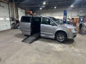 Silver Dodge Grand Caravan with BraunAbility Side Entry Automatic Fold Out conversion