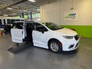 White Chrysler Pacifica with BraunAbility Side Entry Automatic Fold Out conversion
