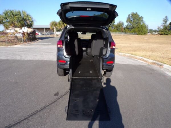 Grey Kia Sorento with Freedom Motors Rear Entry Manual Fold Out conversion