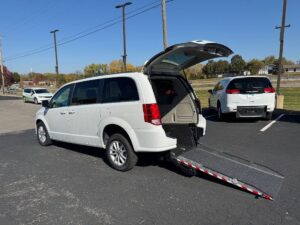 White Dodge Grand Caravan with Driverge Rear Entry Manual Fold Out conversion