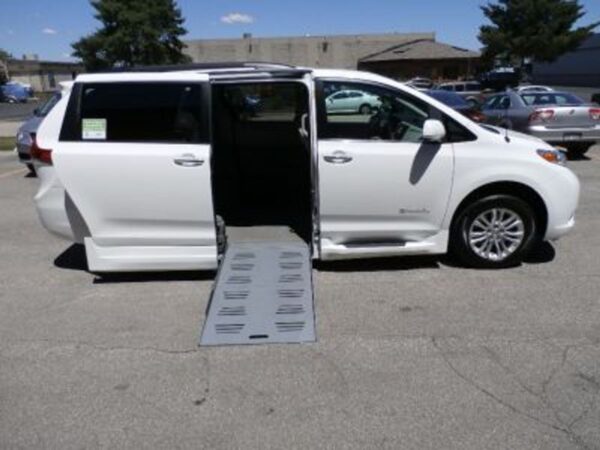 White Toyota Sienna with BraunAbility Side Entry Automatic Fold Out conversion