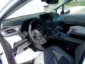 White Toyota Sienna with Driverge Rear Entry Manual Fold Out conversion