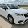 White Chrysler Pacifica with Driverge Side Entry Automatic Fold Out conversion