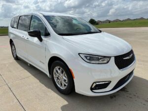 White Chrysler Pacifica with Driverge Side Entry Automatic Fold Out conversion