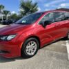 Red Chrysler Voyager with ATS Rear Entry Manual Fold Out conversion