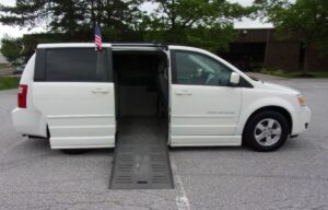 White Dodge Grand Caravan with BraunAbility Side Entry Automatic Fold Out conversion