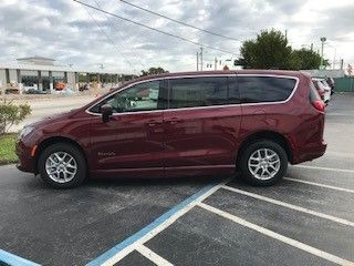 Red Chrysler Voyager with BraunAbility Side Entry Automatic Fold Out conversion
