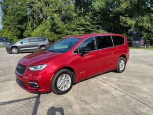 Red Chrysler Pacifica with Driverge Side Entry Automatic Fold Out conversion