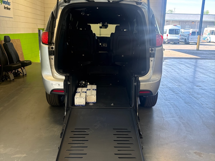 Silver Chrysler Voyager with BraunAbility Rear Entry Manual Fold Out conversion