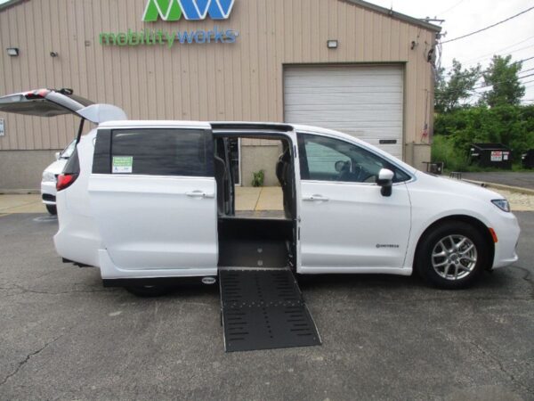 White Chrysler Pacifica with Driverge Side Entry Automatic Fold Out conversion