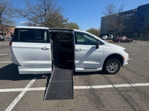 White Chrysler Voyager with Driverge Side Entry Automatic Fold Out conversion