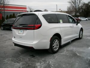 White Chrysler Pacifica with Driverge Side Entry Automatic Fold Out conversion