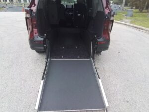 Red Toyota Sienna with Driverge Rear Entry Manual Fold Out conversion