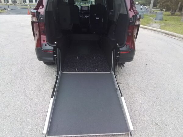 Red Toyota Sienna with Driverge Rear Entry Manual Fold Out conversion