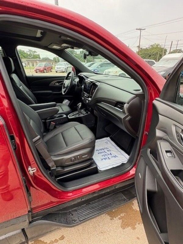 Red Chevrolet Traverse with BraunAbility Side Entry Automatic In Floor conversion