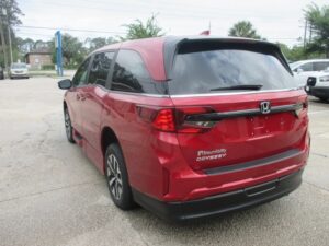 Red Honda Odyssey with BraunAbility Side Entry Automatic In Floor conversion