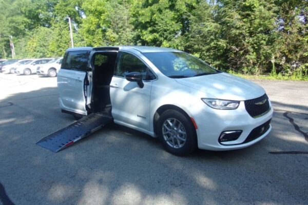 White Chrysler Pacifica with Driverge Side Entry Automatic Fold Out conversion