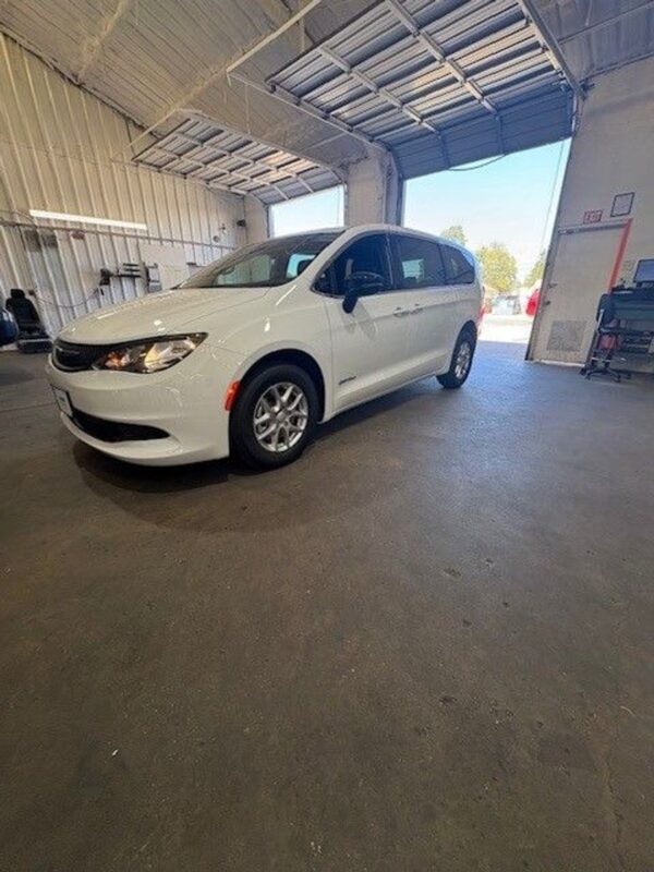 White Chrysler Voyager with Driverge Side Entry Automatic Fold Out conversion