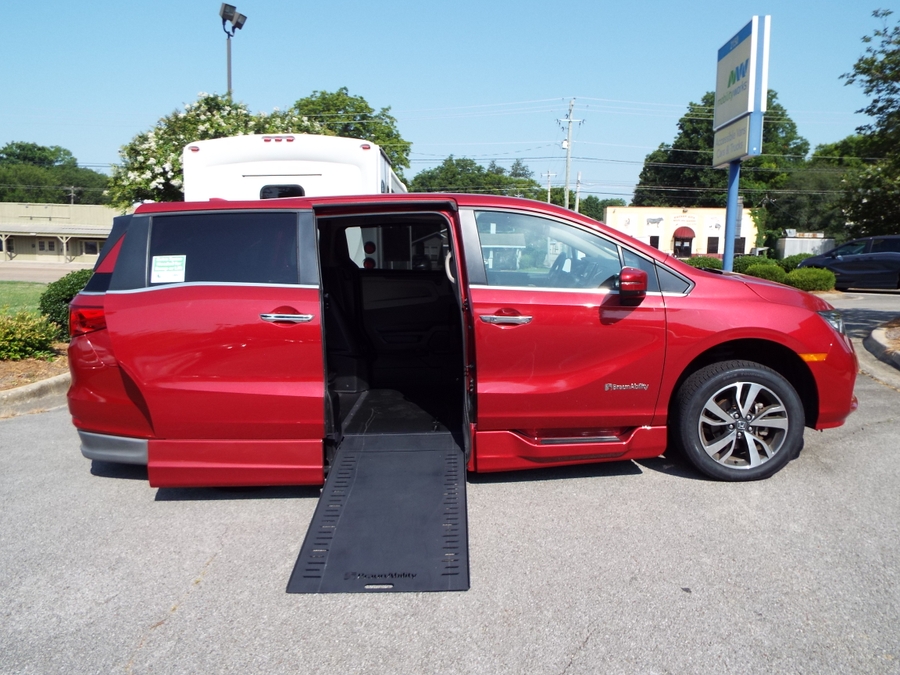Red Honda Odyssey with BraunAbility Side Entry Automatic In Floor conversion