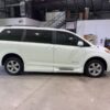 White Toyota Sienna with BraunAbility Side Entry Automatic Fold Out conversion