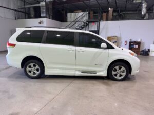 White Toyota Sienna with BraunAbility Side Entry Automatic Fold Out conversion