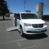 White Dodge Grand Caravan with Other Side Entry Manual Fold Out conversion