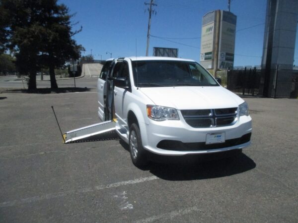 White Dodge Grand Caravan with Other Side Entry Manual Fold Out conversion