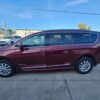 Red Chrysler Pacifica with BraunAbility Side Entry Automatic Fold Out conversion