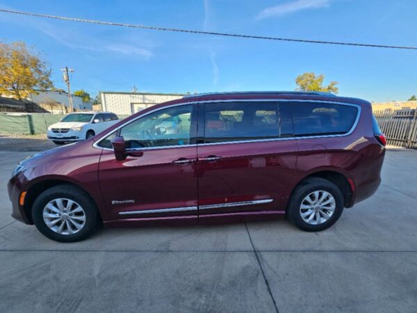 Red Chrysler Pacifica with BraunAbility Side Entry Automatic Fold Out conversion