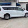 White Chrysler Voyager with Driverge Rear Entry Manual Fold Out conversion