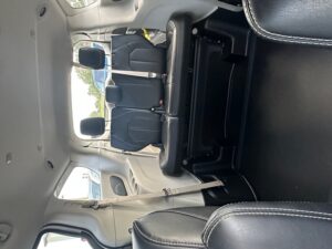 White Chrysler Pacifica with BraunAbility Side Entry Automatic Fold Out conversion