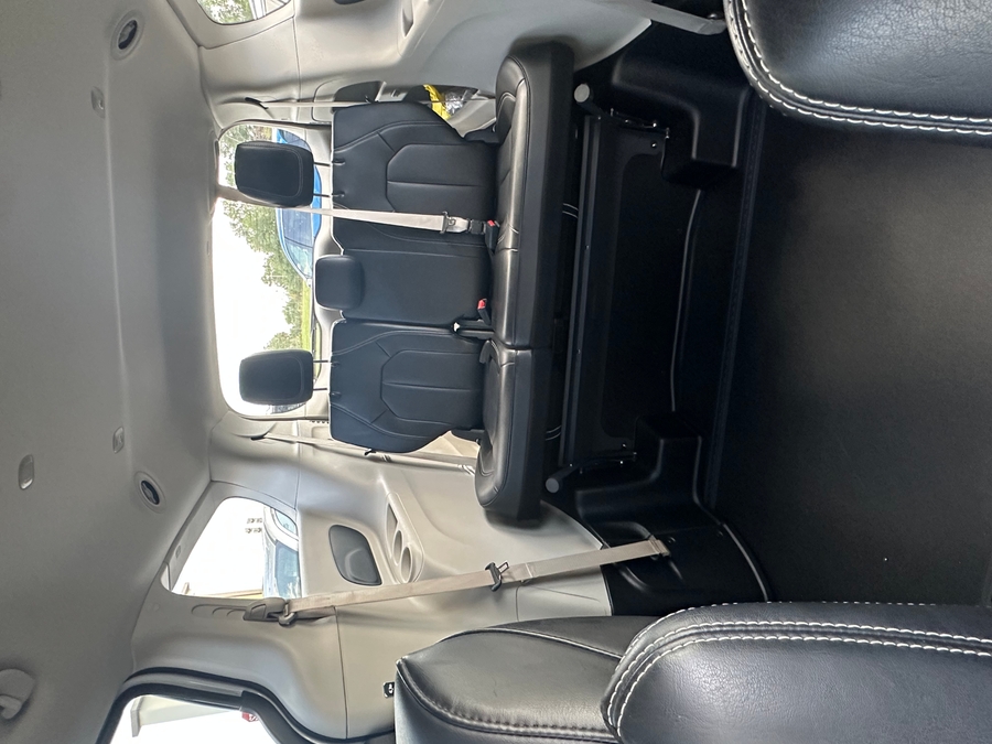 White Chrysler Pacifica with BraunAbility Side Entry Automatic Fold Out conversion
