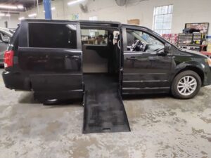 Black Dodge Grand Caravan with BraunAbility Side Entry Automatic Fold Out conversion