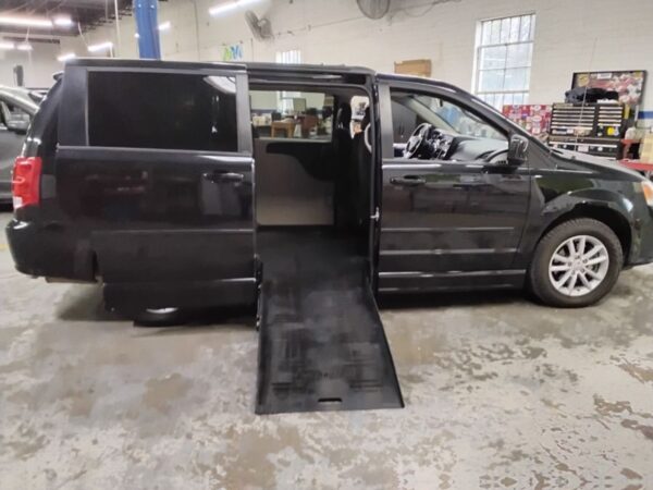 Black Dodge Grand Caravan with BraunAbility Side Entry Automatic Fold Out conversion