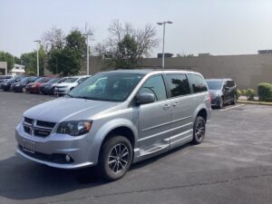Silver Dodge Grand Caravan with BraunAbility Side Entry Automatic In Floor conversion