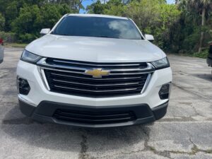 White Chevrolet Traverse with BraunAbility Side Entry Automatic In Floor conversion