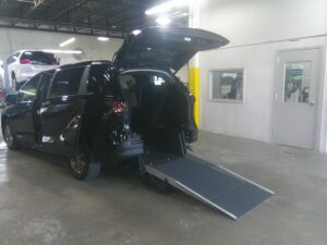 Black Toyota Sienna with Driverge Rear Entry Manual Fold Out conversion