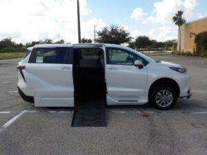 White Toyota Sienna with BraunAbility Side Entry Automatic Fold Out conversion