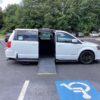 White Dodge Grand Caravan with Driverge Side Entry Automatic Fold Out conversion