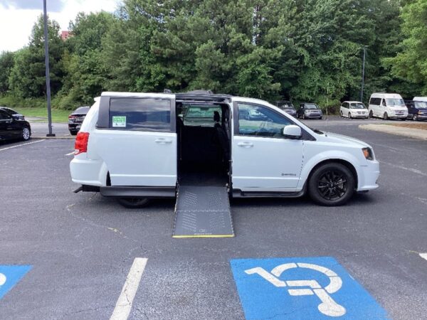 White Dodge Grand Caravan with Driverge Side Entry Automatic Fold Out conversion