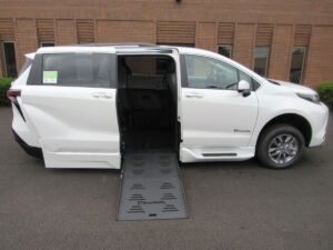White Toyota Sienna with BraunAbility Side Entry Automatic Fold Out conversion