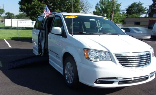White Chrysler Town and Country with BraunAbility Side Entry Automatic Fold Out conversion