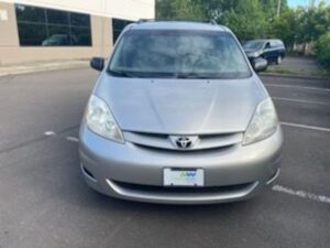Silver Toyota Sienna with BraunAbility Side Entry Automatic Fold Out conversion