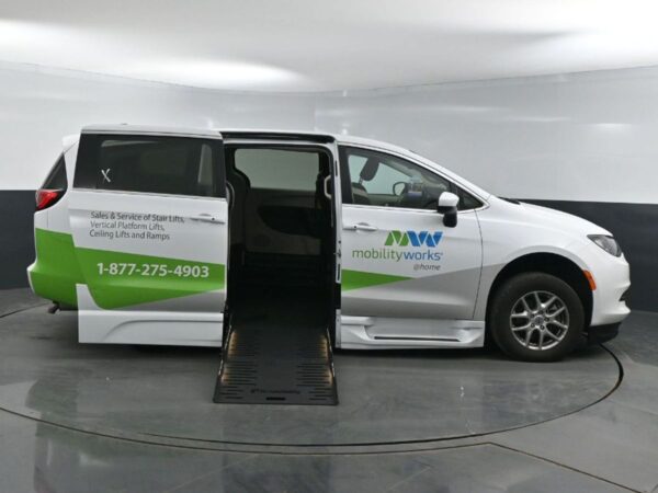 White Chrysler Voyager with BraunAbility Side Entry Automatic Fold Out conversion