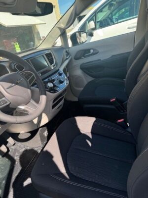 White Chrysler Voyager with Driverge Side Entry Automatic Fold Out conversion