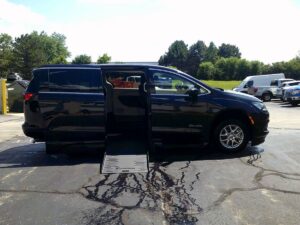 Black Chrysler Voyager with BraunAbility Side Entry Automatic Fold Out conversion