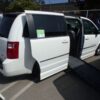 White Dodge Grand Caravan with BraunAbility Side Entry Automatic Fold Out conversion