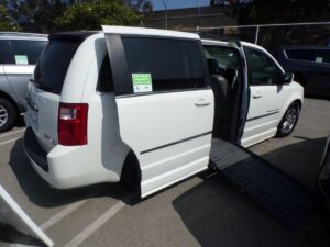 White Dodge Grand Caravan with BraunAbility Side Entry Automatic Fold Out conversion